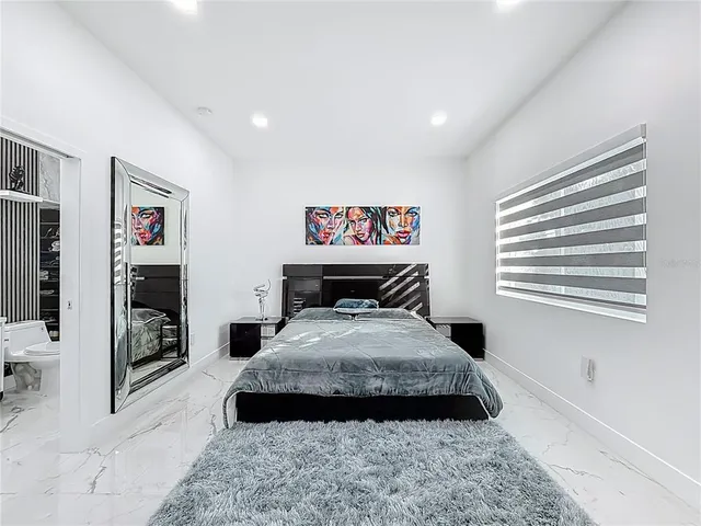 a bathroom with a toilet a sink and bathtub