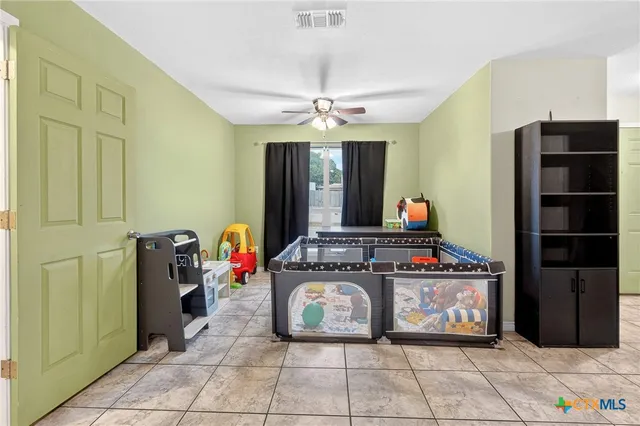 a kitchen with stainless steel appliances granite countertop a stove and a refrigerator