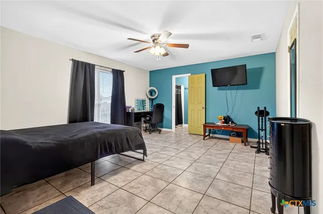 a bedroom with a bed and a walk in closet