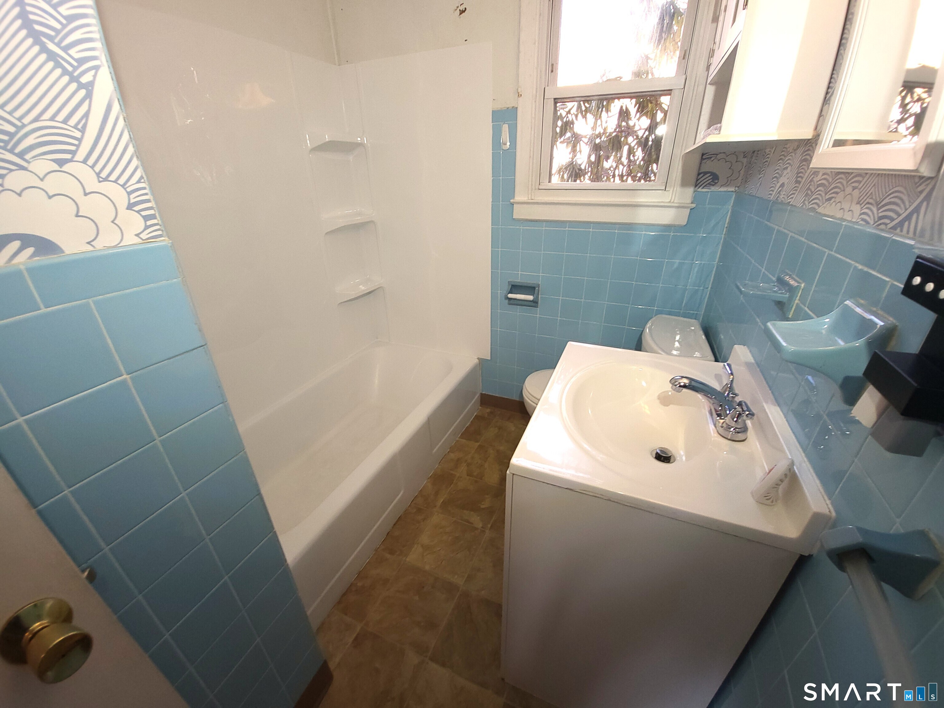 19 Bancroft Road Vernon, CT 06066 - Photo 12 of 28 a bathroom with a sink and a window