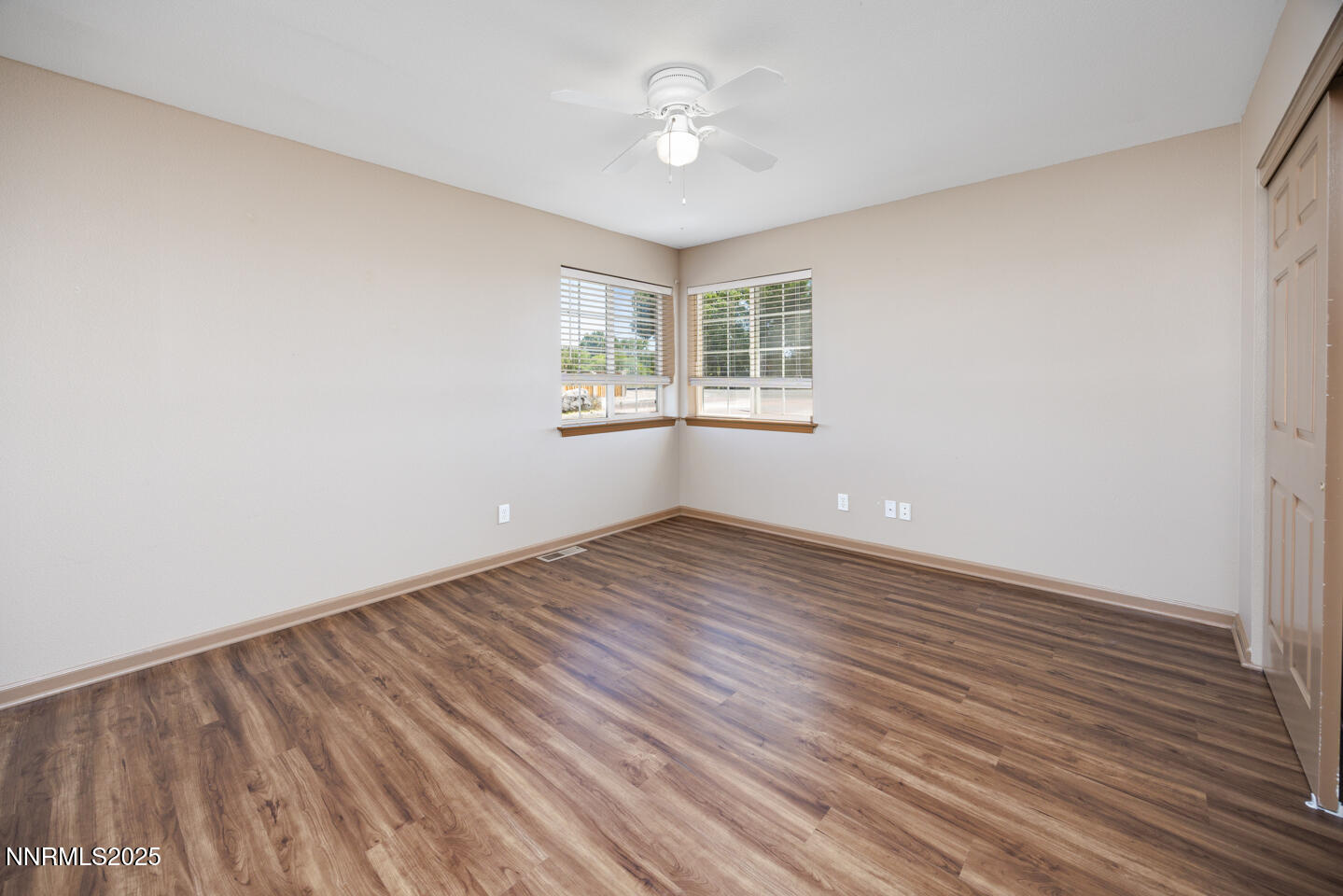 305 Cemetery Road Fallon, NV 89406 - Photo 11 of 26 wooden floor in an empty room with a window