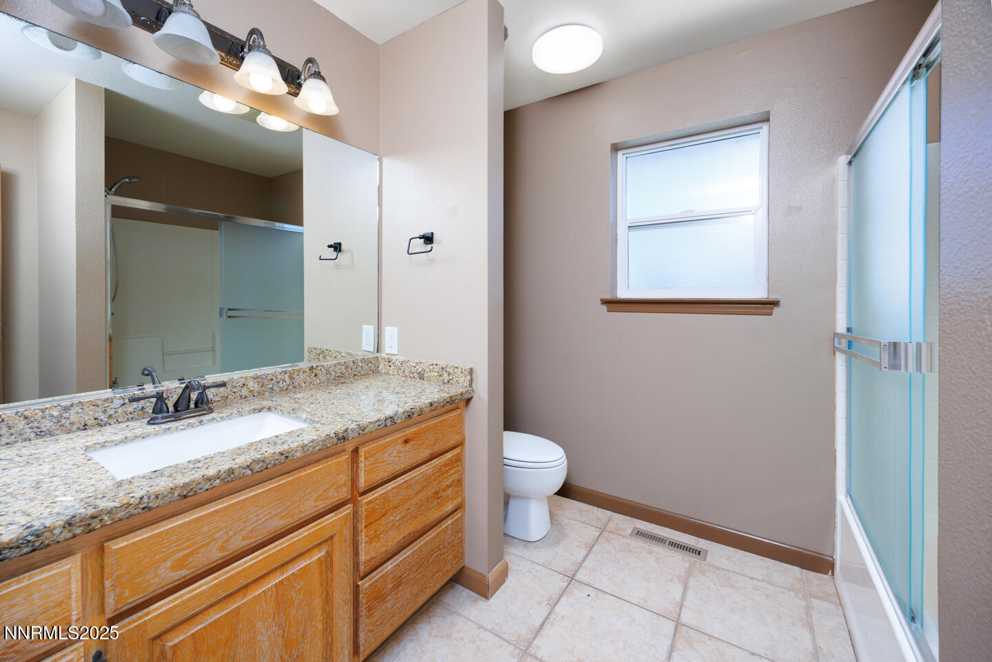 305 Cemetery Road Fallon, NV 89406 - Photo 13 of 26 a bathroom with a granite countertop sink toilet and shower