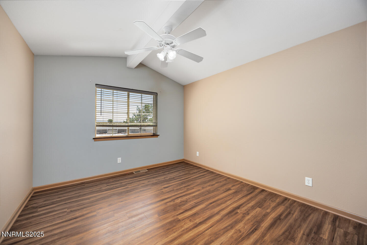 305 Cemetery Road Fallon, NV 89406 - Photo 14 of 26 a view of an empty room with wooden floor and a window