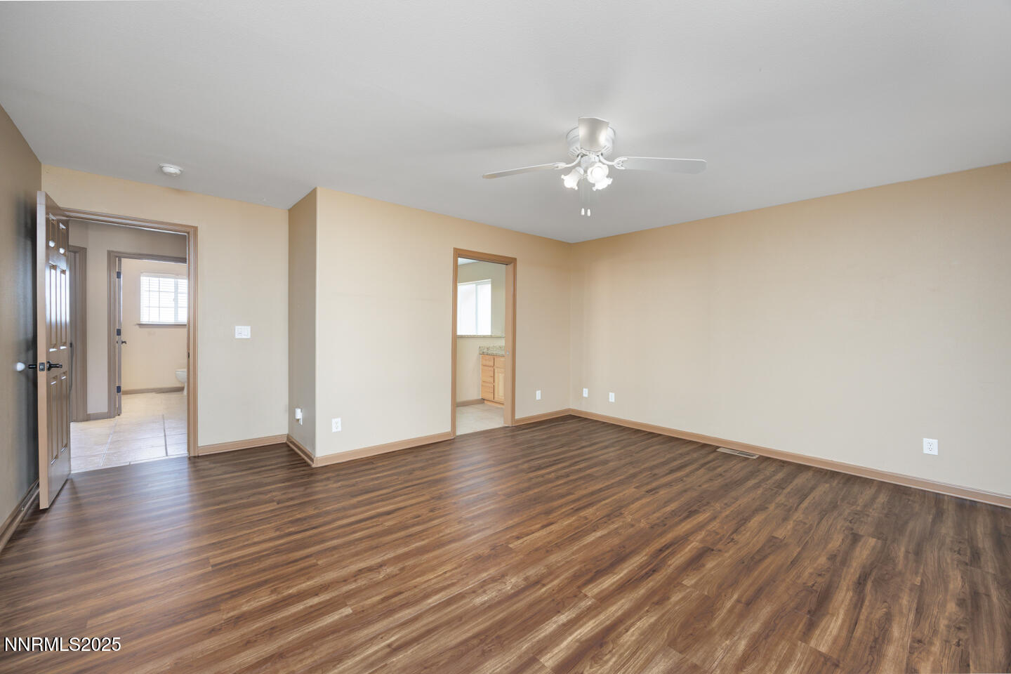 305 Cemetery Road Fallon, NV 89406 - Photo 15 of 26 a view of an empty room with wooden floor