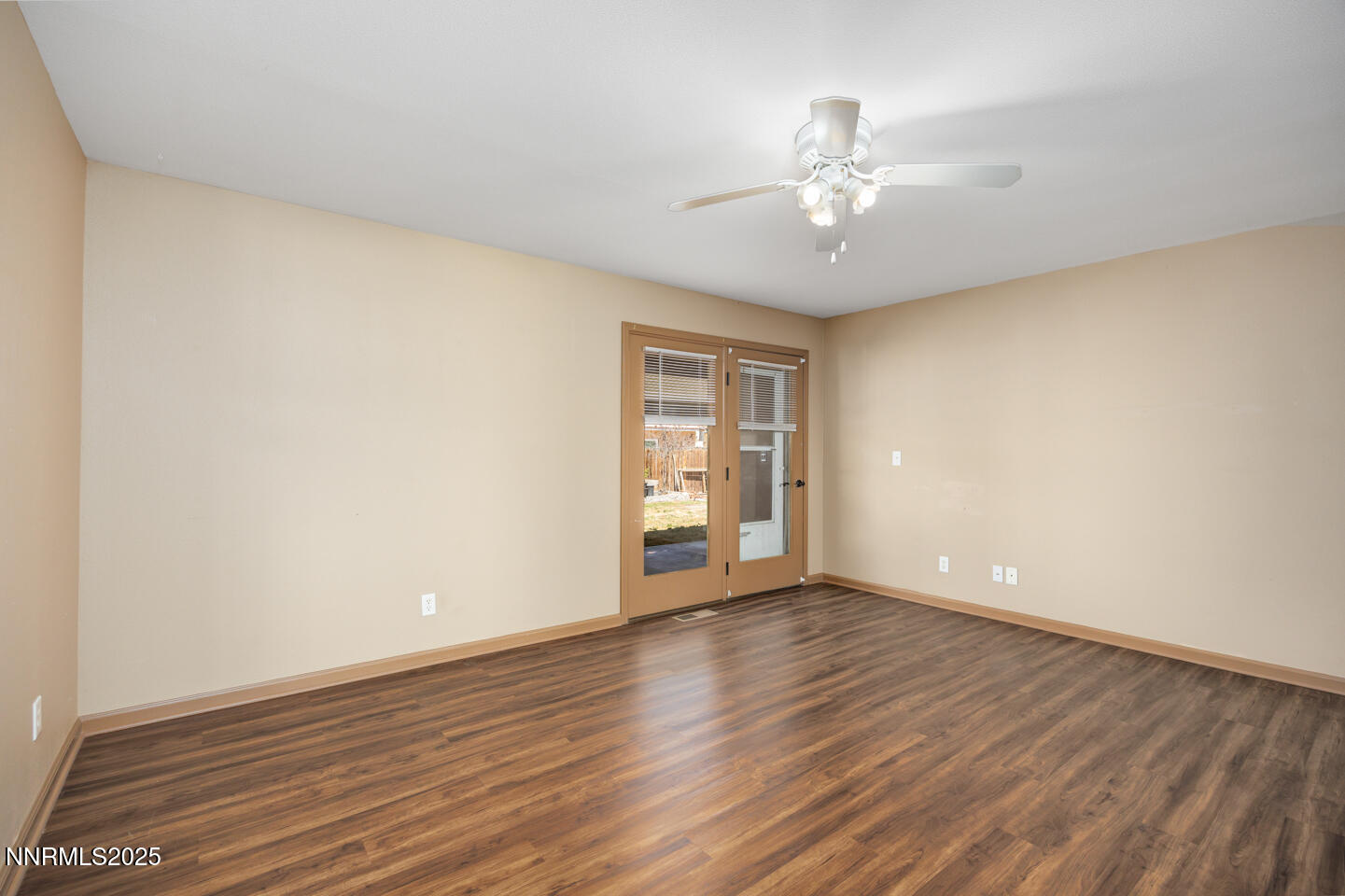 305 Cemetery Road Fallon, NV 89406 - Photo 16 of 26 a view of an empty room with wooden floor and a window