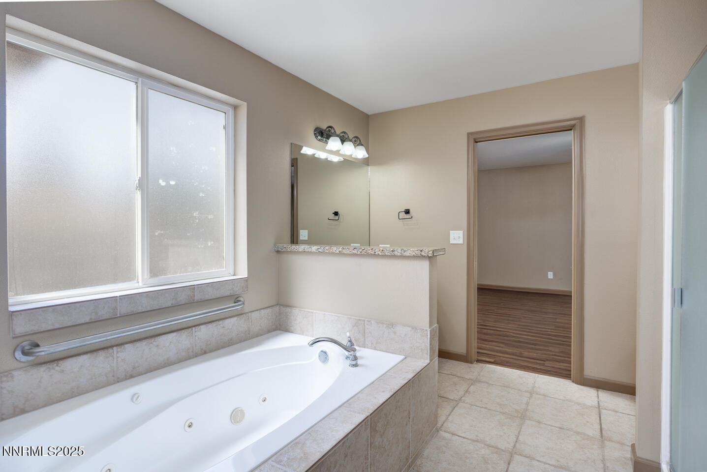 305 Cemetery Road Fallon, NV 89406 - Photo 19 of 26 a bathroom with a bathtub and a sink