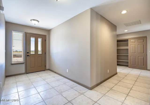 a view of an empty room and window