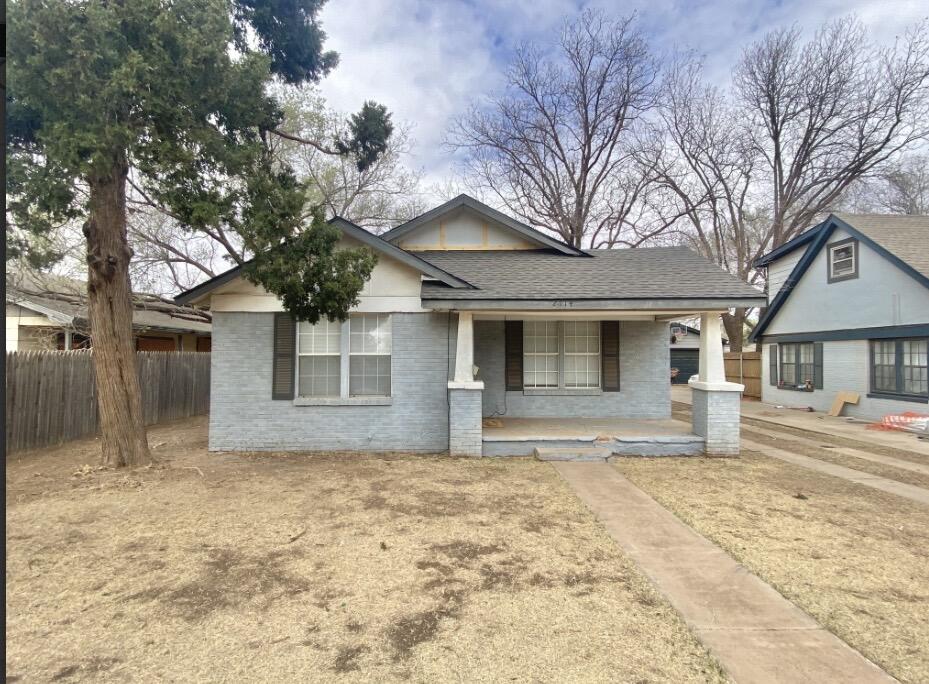 2114 27th Street Lubbock, TX 79411 - Photo 1 of 9 a house that has a tree in front of it