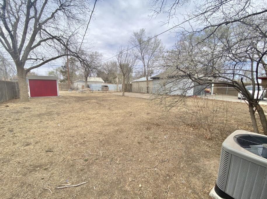 2114 27th Street Lubbock, TX 79411 - Photo 9 of 9 a view of yard covered with snow in front of house