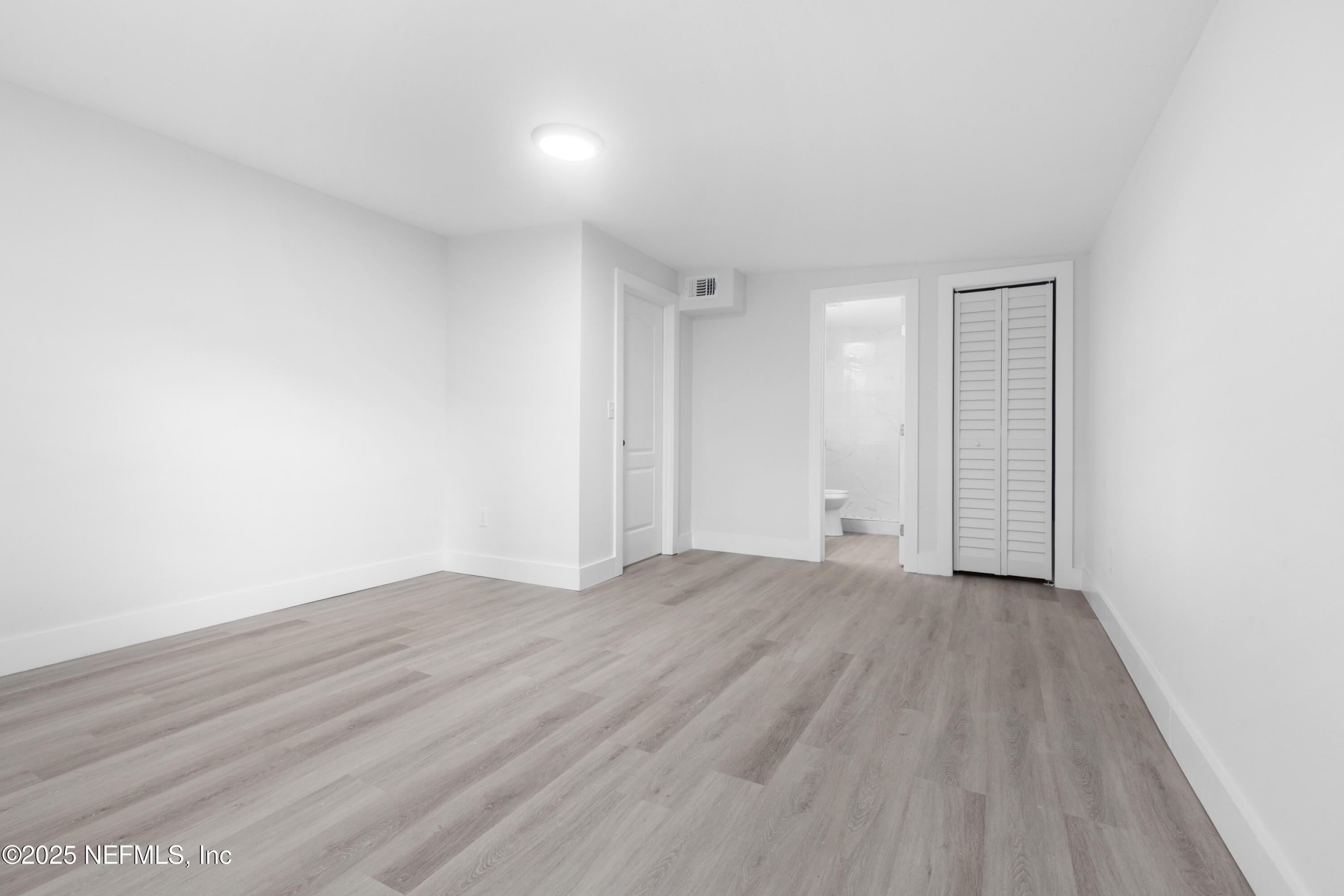 9166 3rd Avenue Jacksonville, FL 32208 - Photo 12 of 23 a view of an empty room and wooden floor