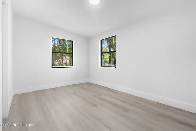 an empty room with windows