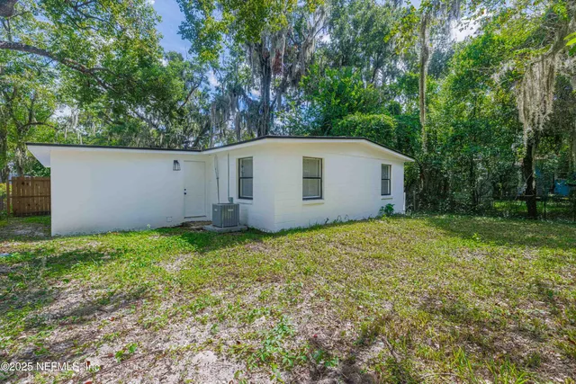a house with trees in the background