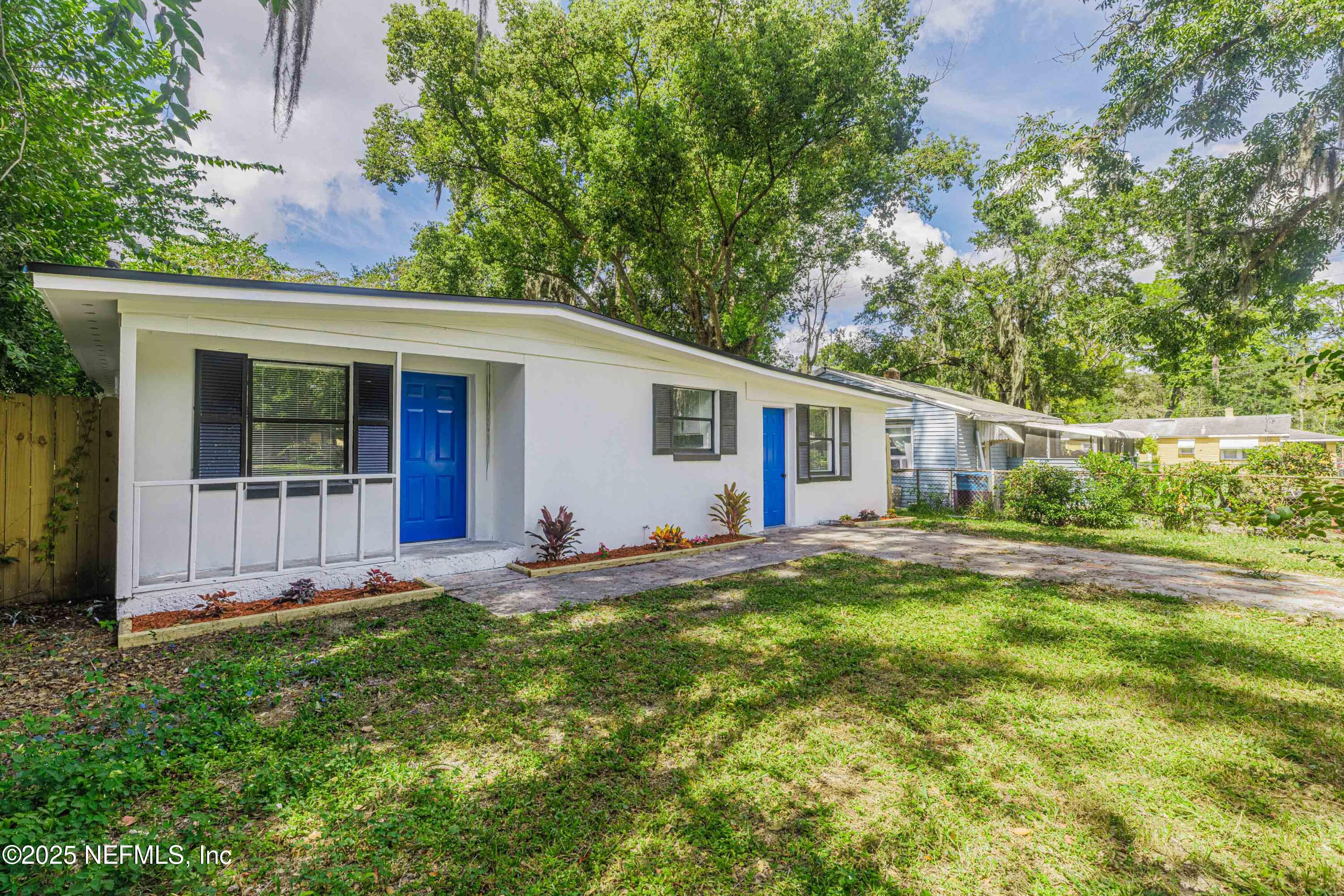 9166 3rd Avenue Jacksonville, FL 32208 - Photo 4 of 23 front view of a house with a yard