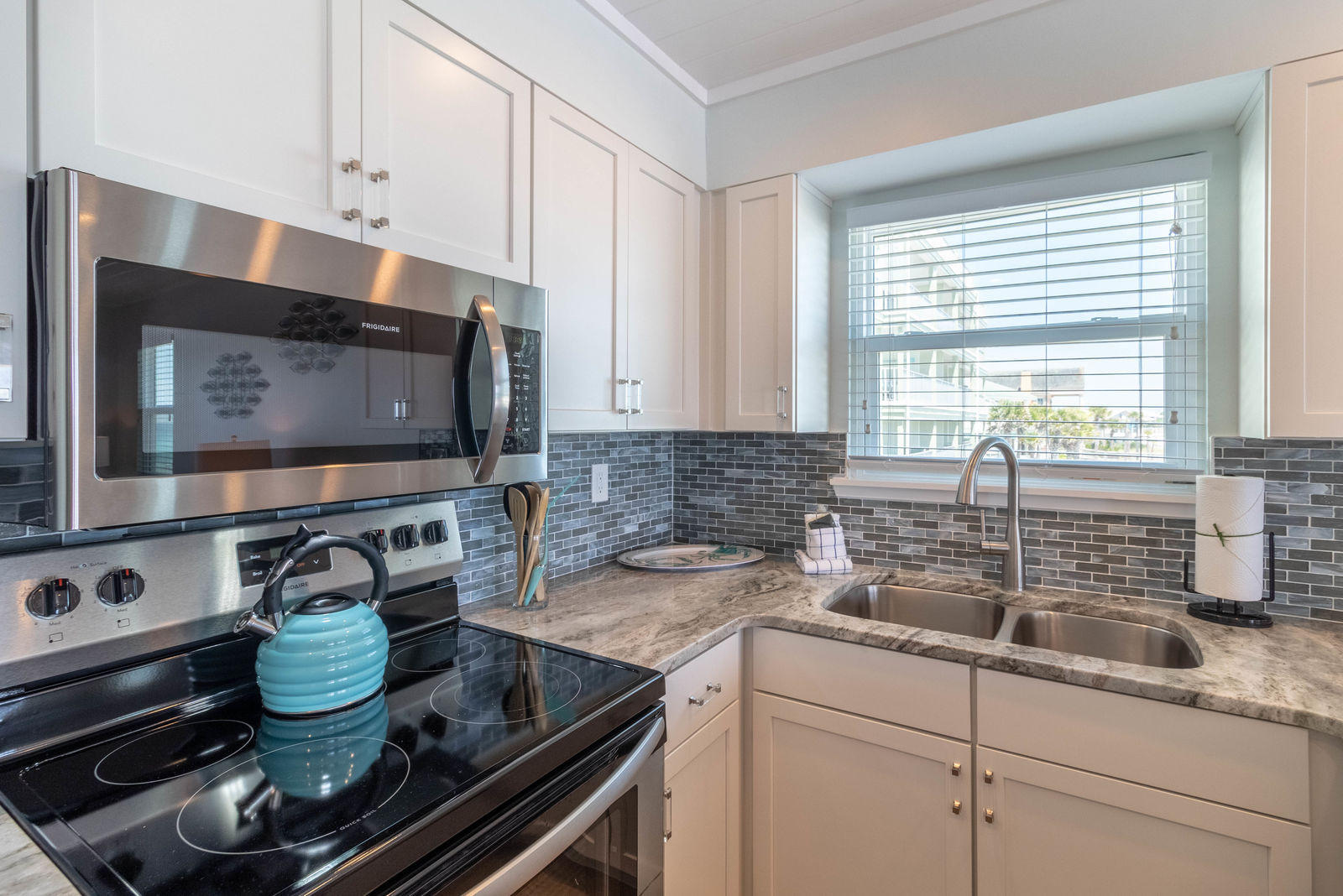 595 Eastern Lake Road, Unit 206 Santa Rosa Beach, FL 32459 - Photo 14 of 33 a kitchen with a stove and a microwave