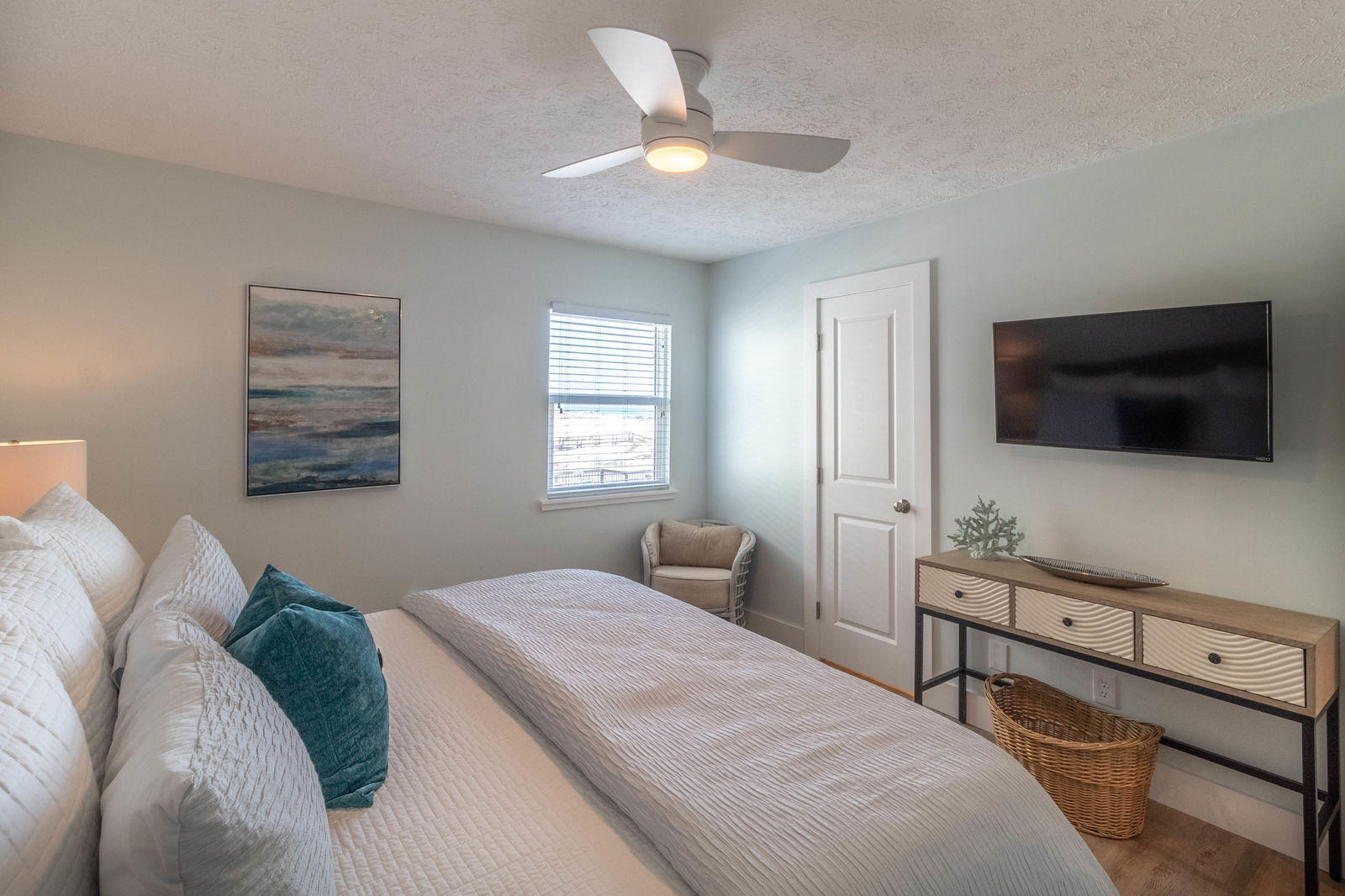 595 Eastern Lake Road, Unit 206 Santa Rosa Beach, FL 32459 - Photo 17 of 33 a bedroom with a bed and a flat screen tv