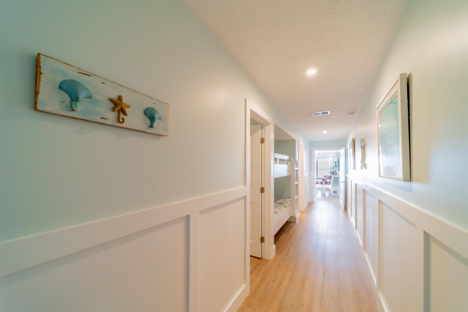 595 Eastern Lake Road, Unit 206 Santa Rosa Beach, FL 32459 - Photo 23 of 33 a view of a hallway with wooden floor