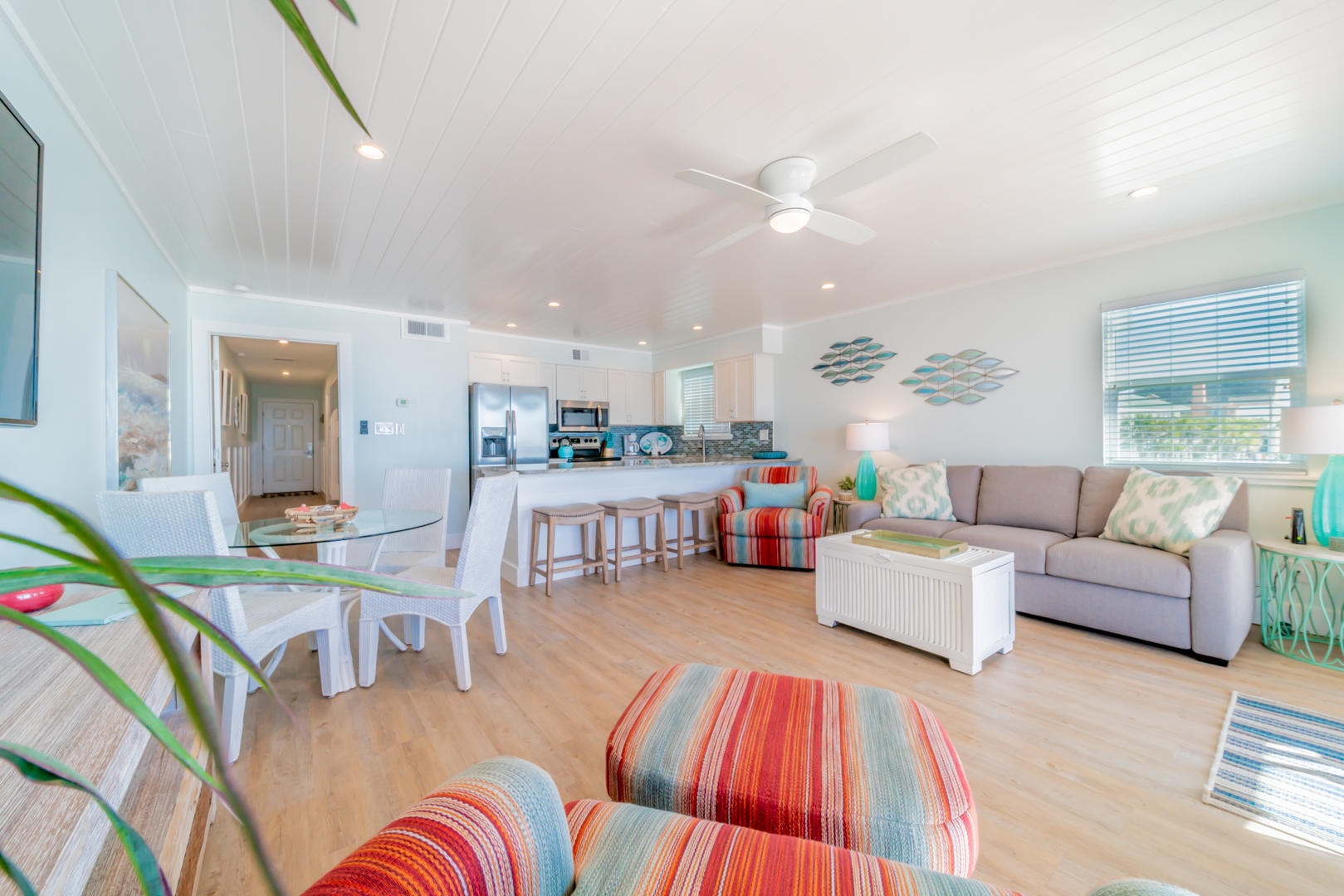 595 Eastern Lake Road, Unit 206 Santa Rosa Beach, FL 32459 - Photo 5 of 33 a living room with furniture kitchen view and a large window
