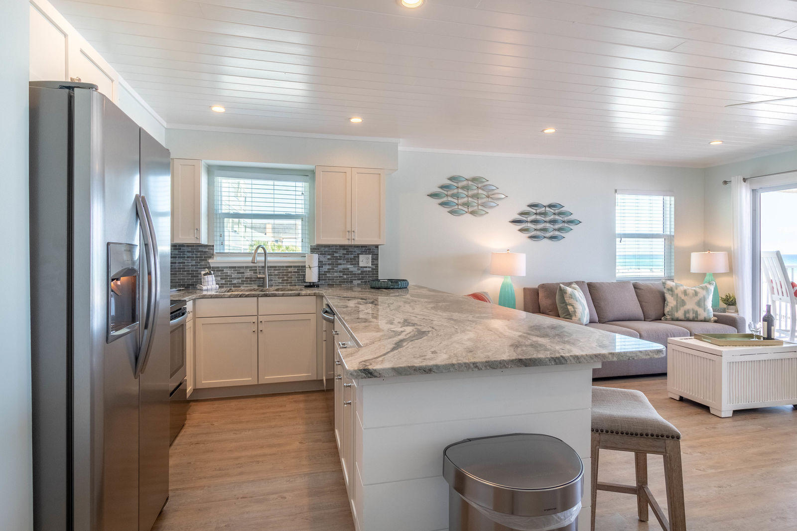 595 Eastern Lake Road, Unit 206 Santa Rosa Beach, FL 32459 - Photo 10 of 33 a kitchen with stainless steel appliances granite countertop a sink dishwasher a refrigerator a stove and white cabinets with wooden floor