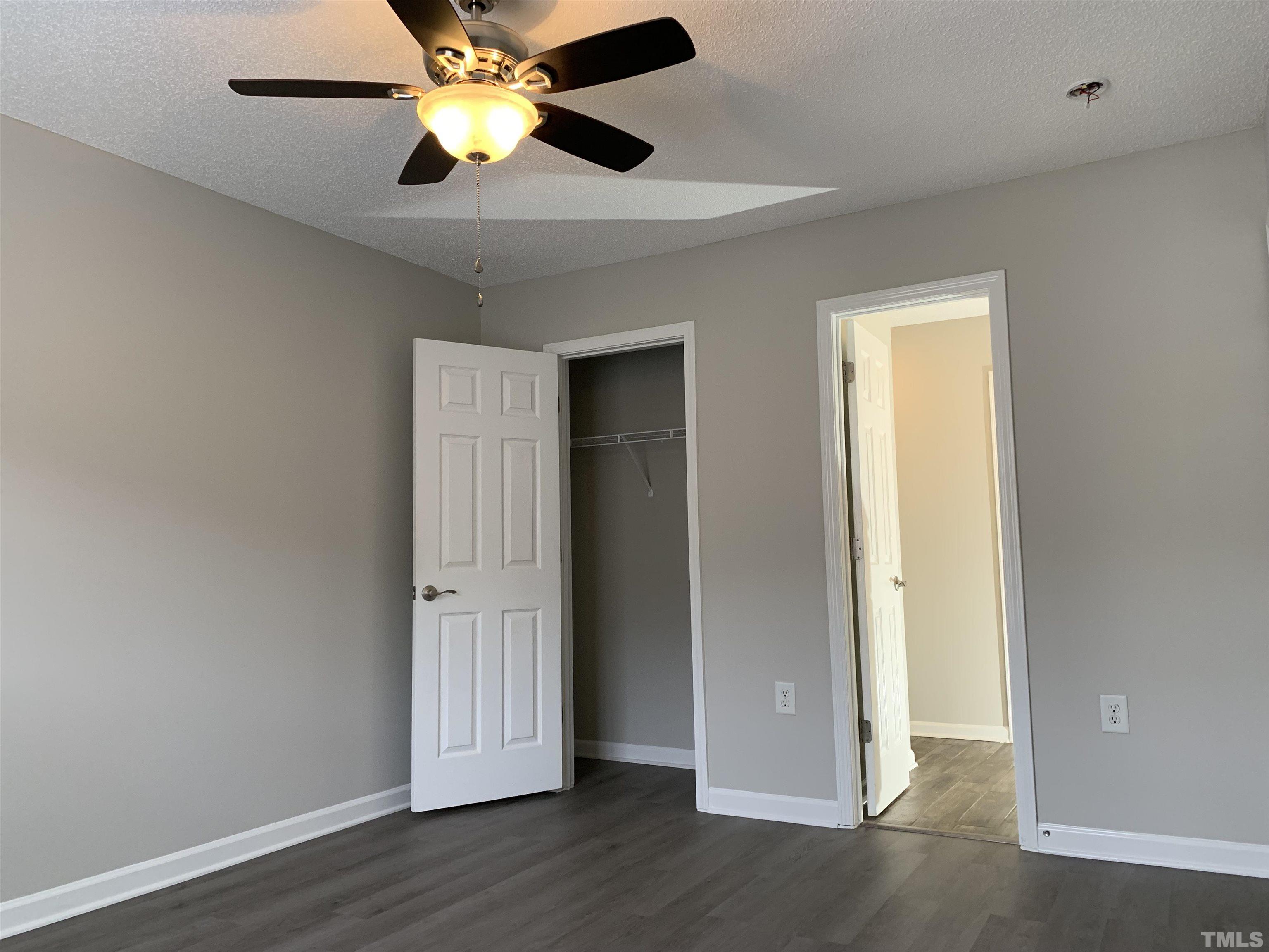 11320 Clubhaven Place, Unit 102 Raleigh, NC 27617 - Photo 3 of 15 a view of an empty room with wooden floor