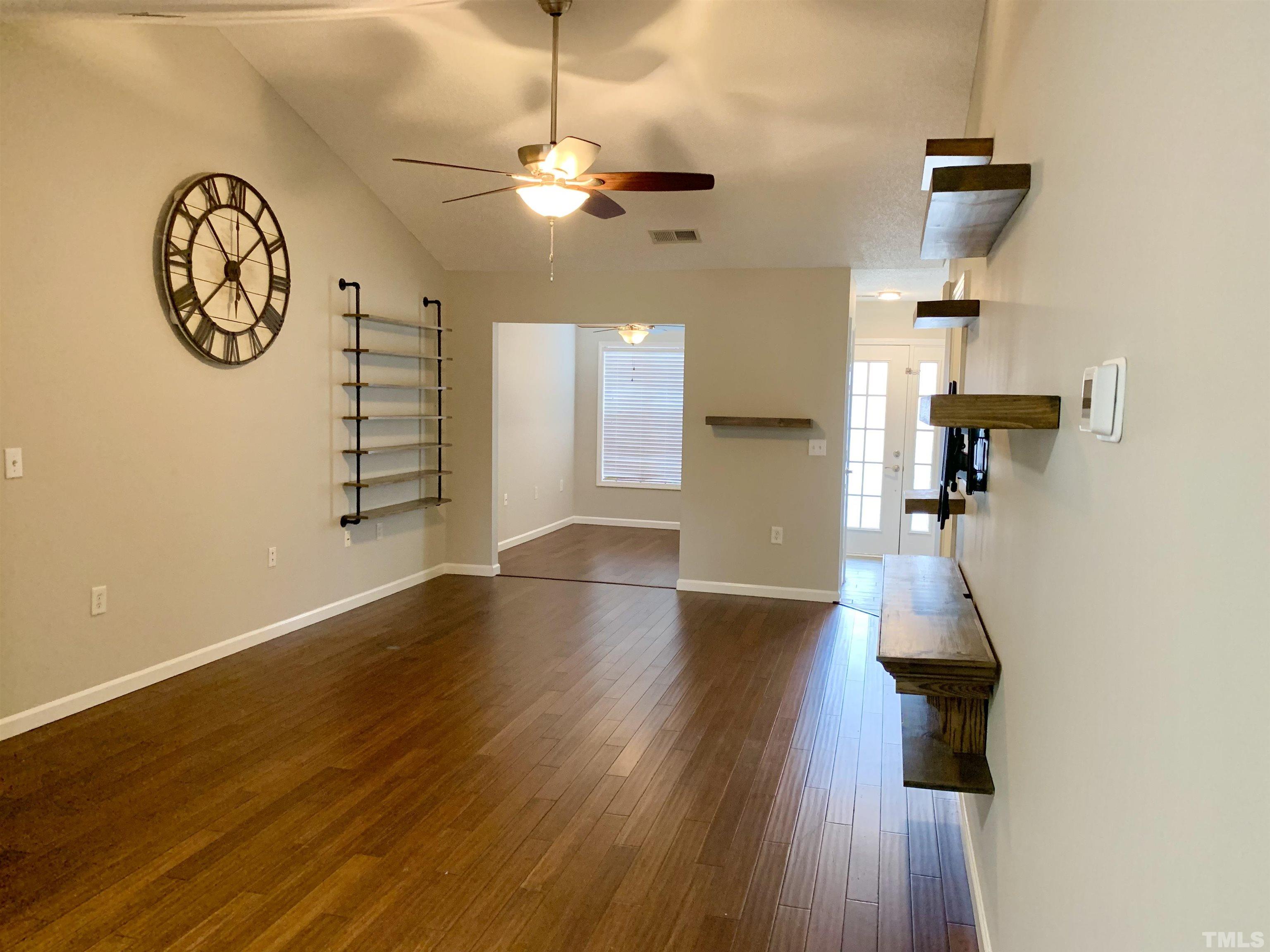 11320 Clubhaven Place, Unit 102 Raleigh, NC 27617 - Photo 8 of 15 a view of a hallway with wooden floor