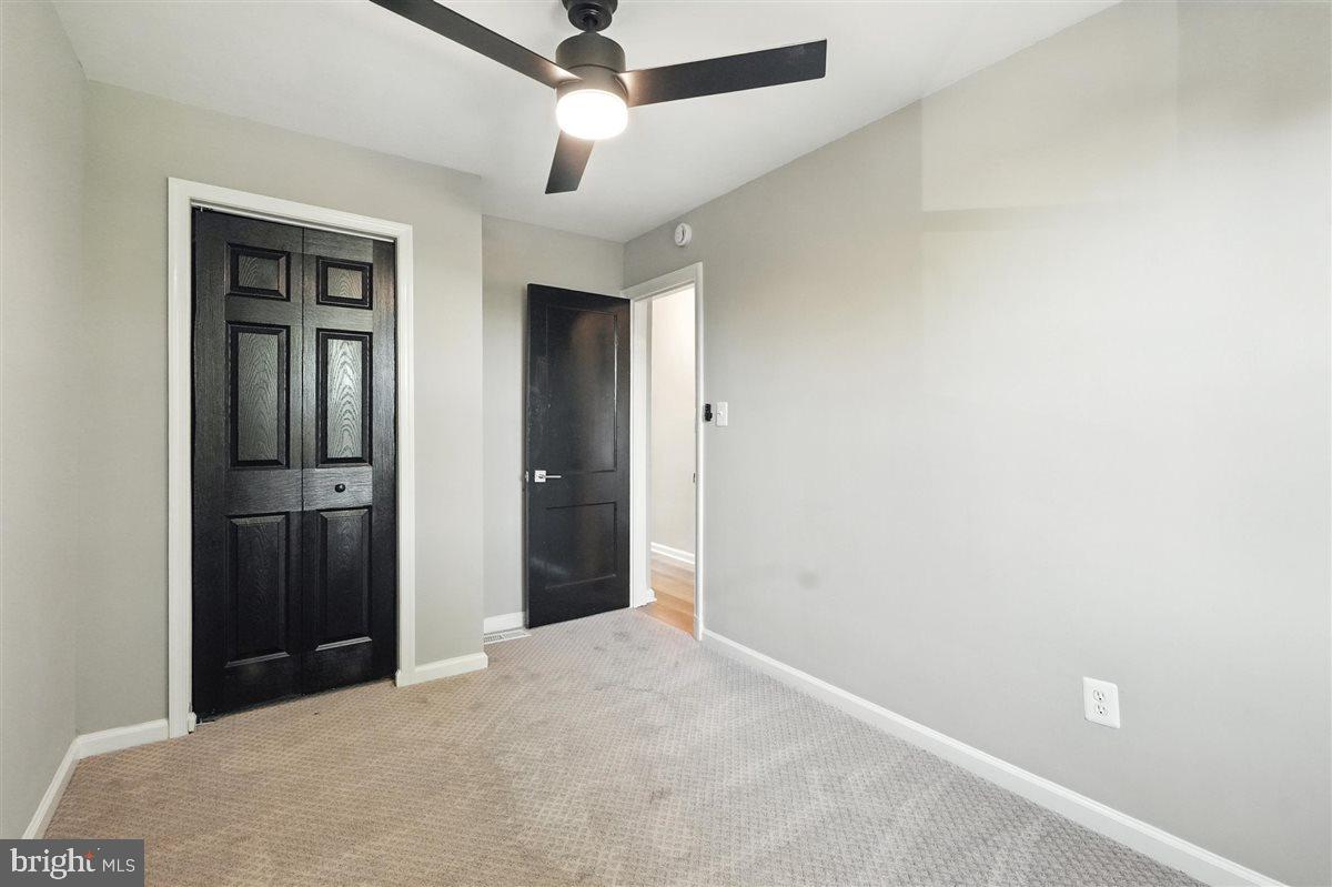 2613 Franklin Street Northeast Washington, DC 20018 - Photo 13 of 29 an empty room with closet and a ceiling fan