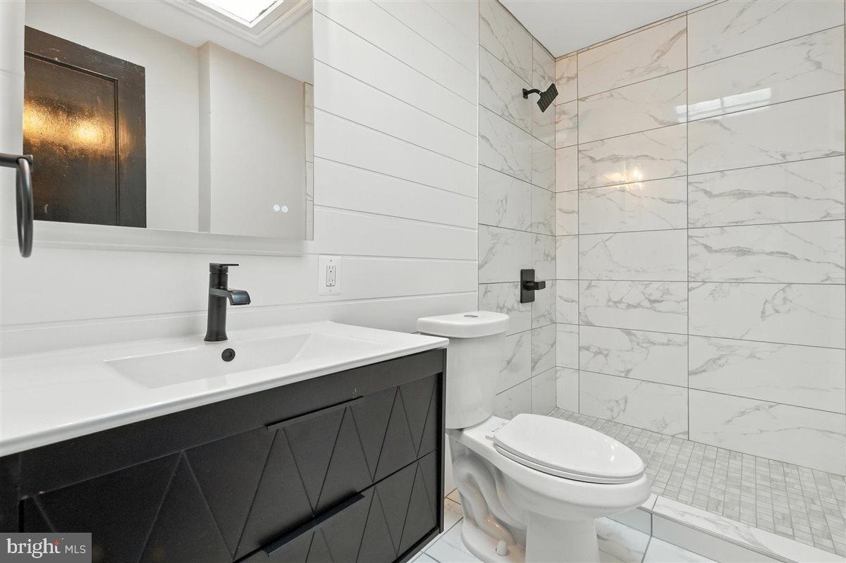 2613 Franklin Street Northeast Washington, DC 20018 - Photo 15 of 29 a bathroom with a sink toilet and shower