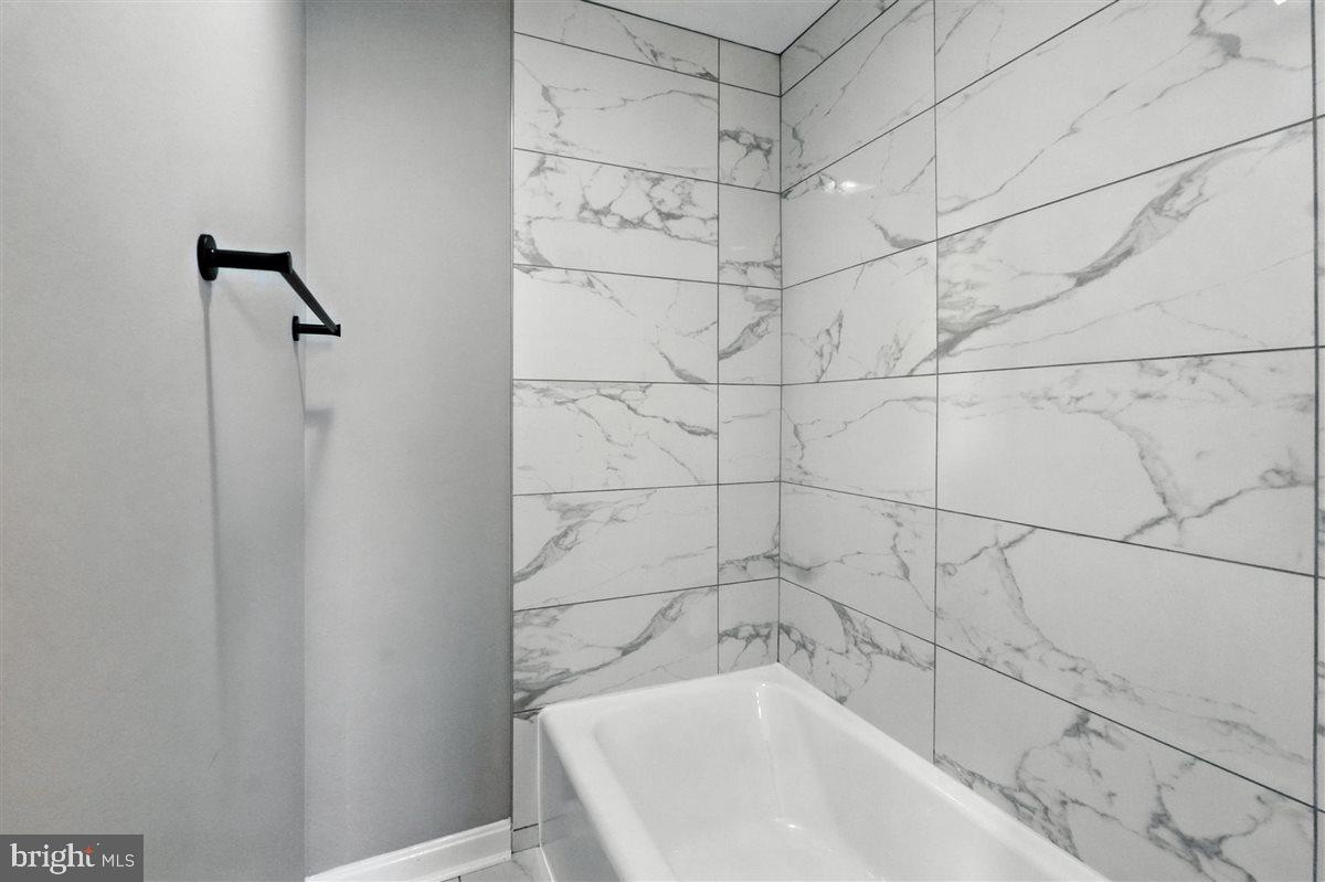 2613 Franklin Street Northeast Washington, DC 20018 - Photo 17 of 29 a bathroom with a bathtub