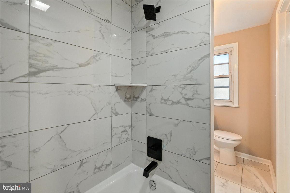 2613 Franklin Street Northeast Washington, DC 20018 - Photo 18 of 29 a bathroom with a toilet and a shower