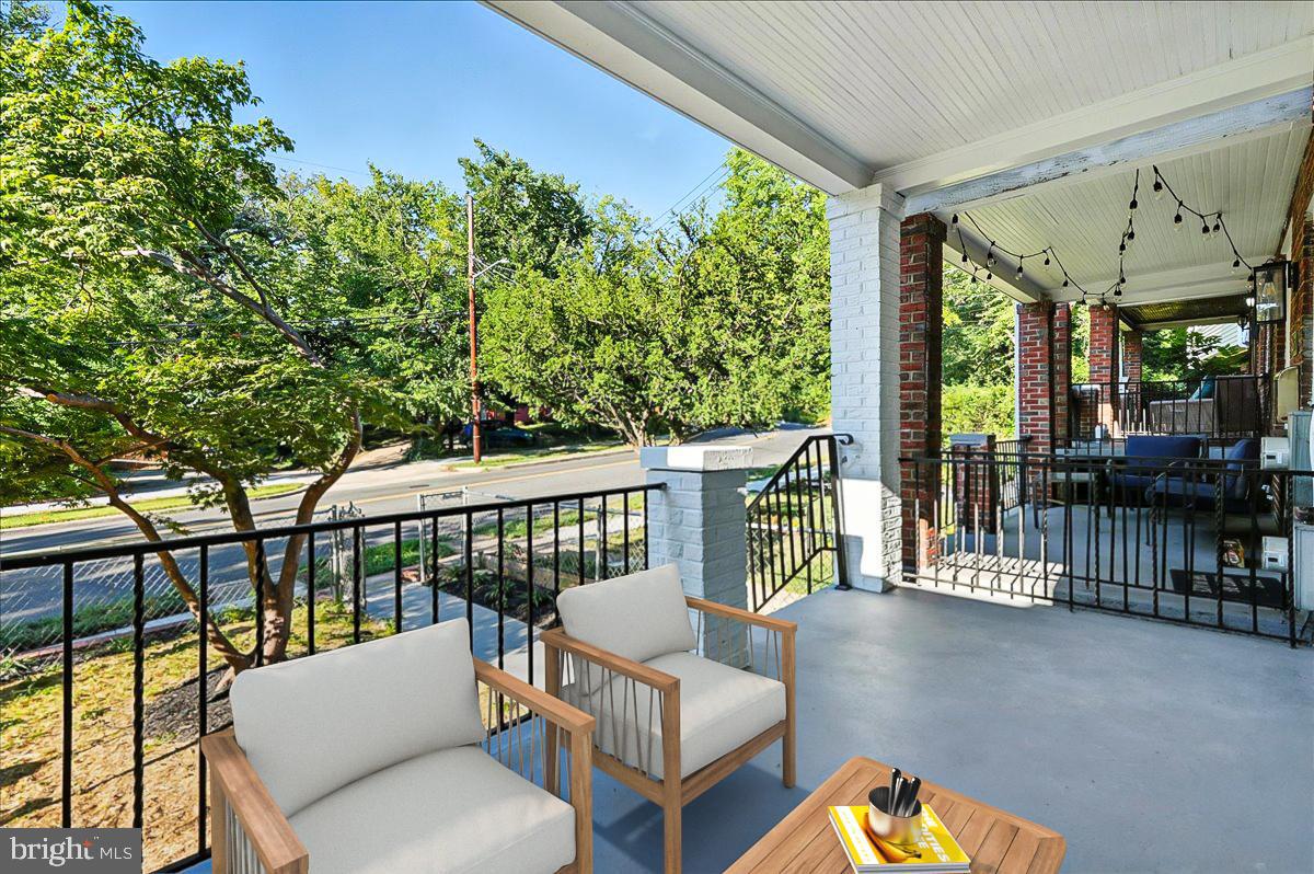 2613 Franklin Street Northeast Washington, DC 20018 - Photo 3 of 29 a balcony with wooden floor and outdoor seating