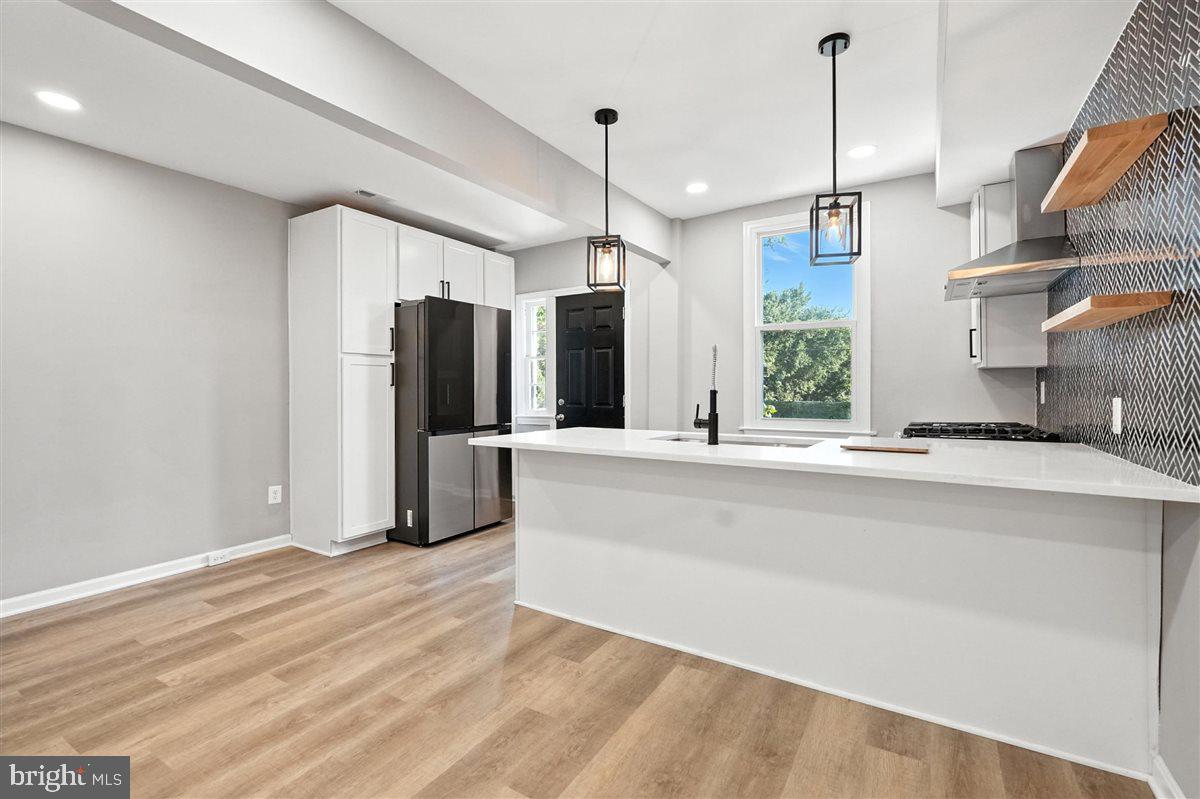 2613 Franklin Street Northeast Washington, DC 20018 - Photo 6 of 29 a view of a kitchen with a refrigerator a sink and a window