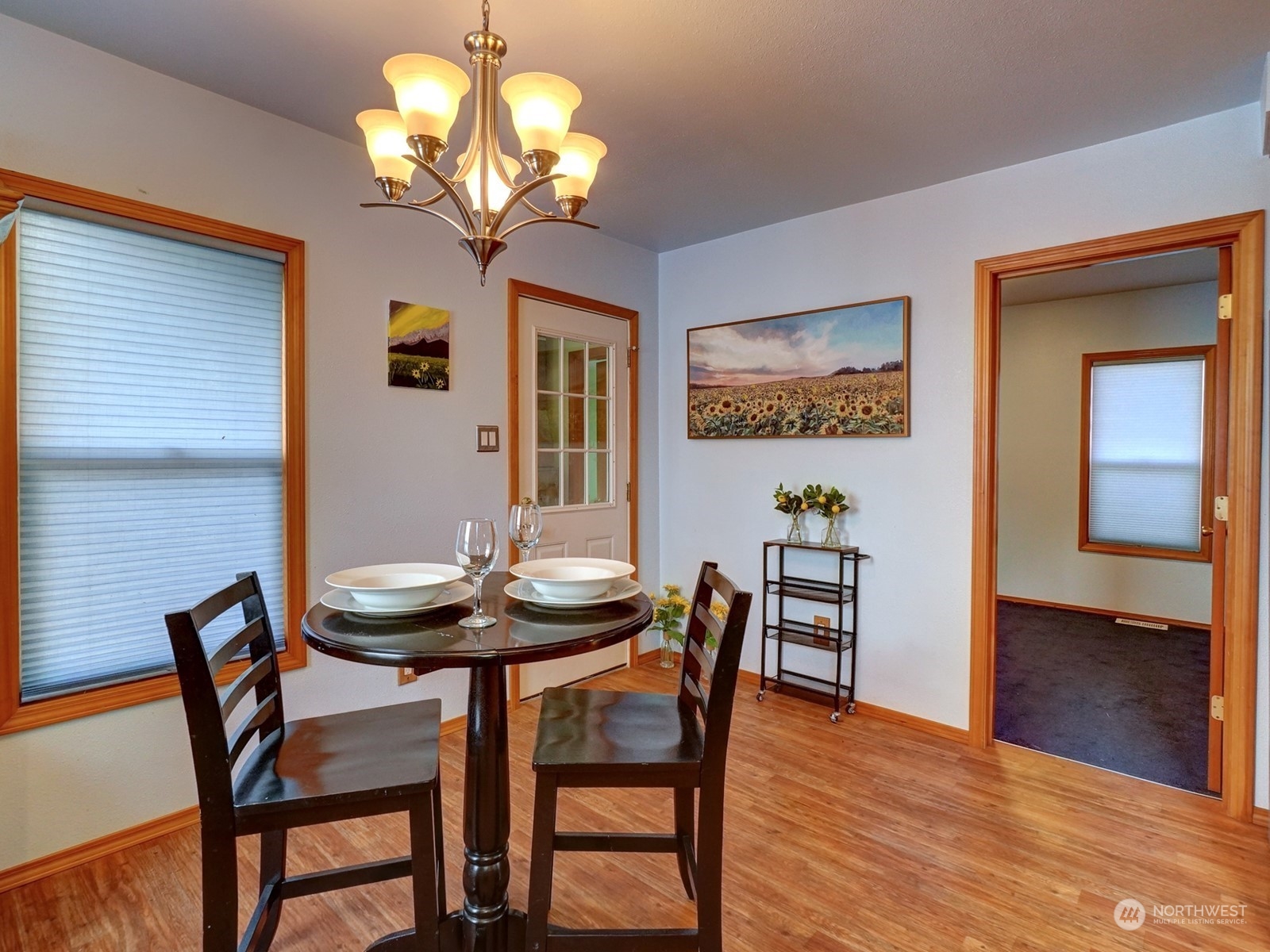 1206 Sumner Avenue Sumner, WA 98390 - Photo 11 of 30 a view of a dining room with furniture and wooden floor