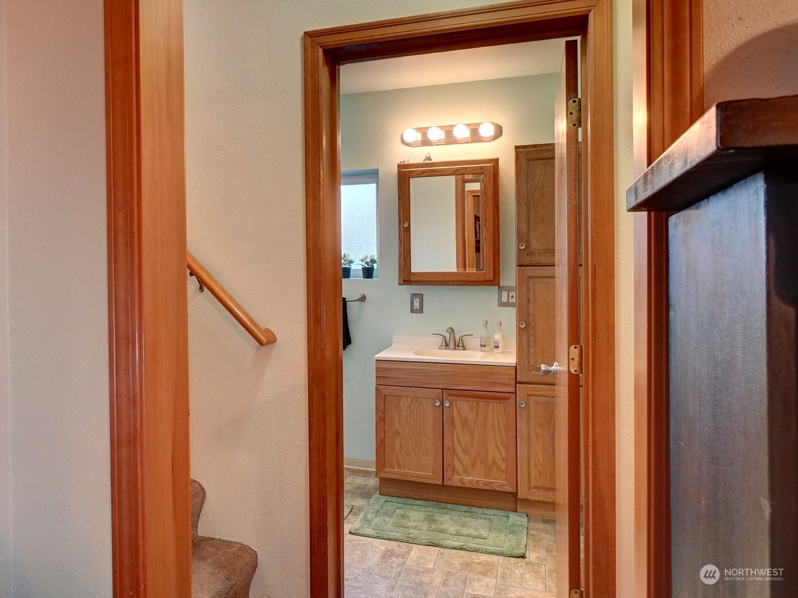 1206 Sumner Avenue Sumner, WA 98390 - Photo 19 of 30 a bathroom with a sink a toilet and mirror