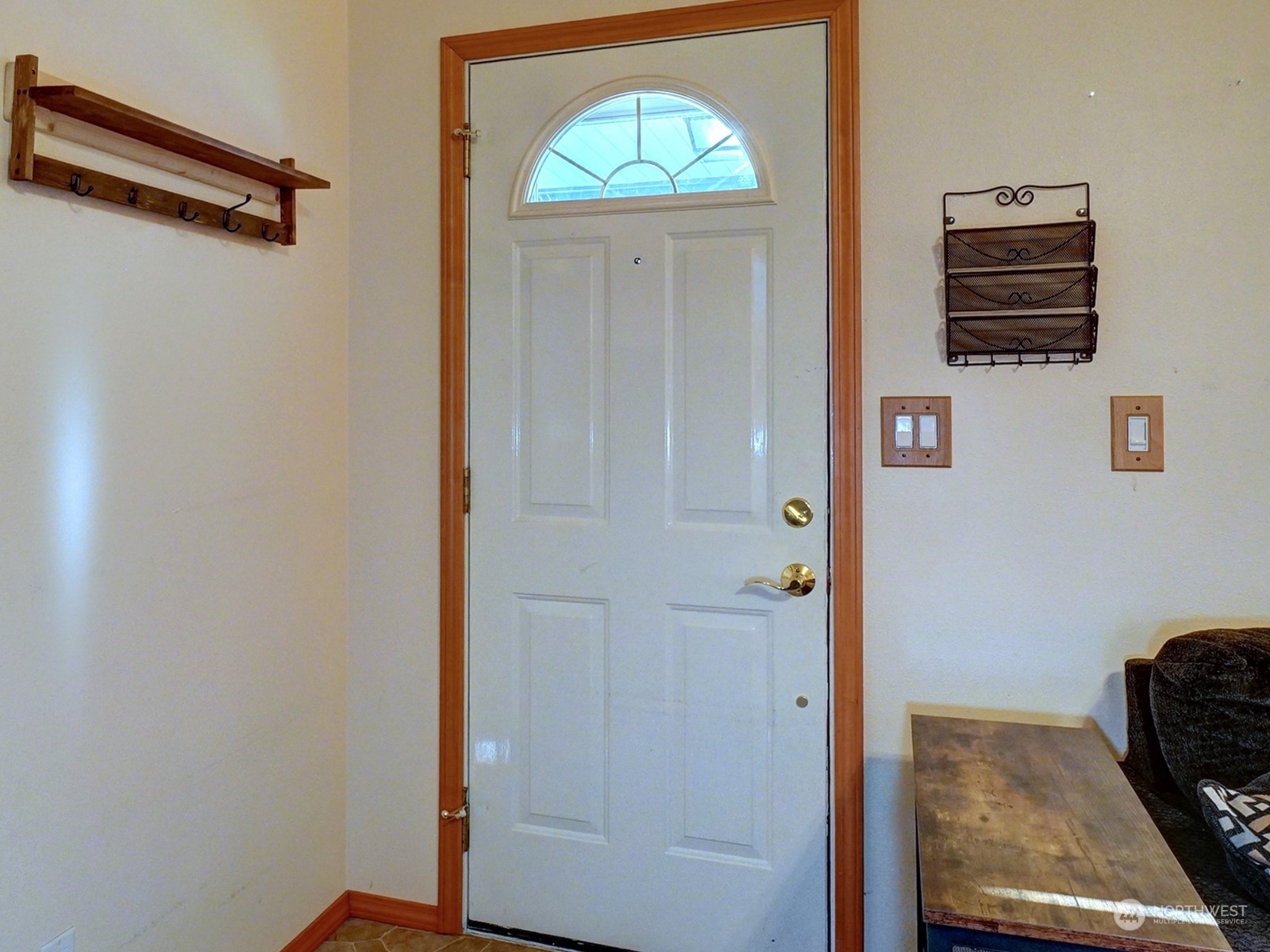 1206 Sumner Avenue Sumner, WA 98390 - Photo 3 of 30 a view of a hallway with entryway wooden floor and cabinet