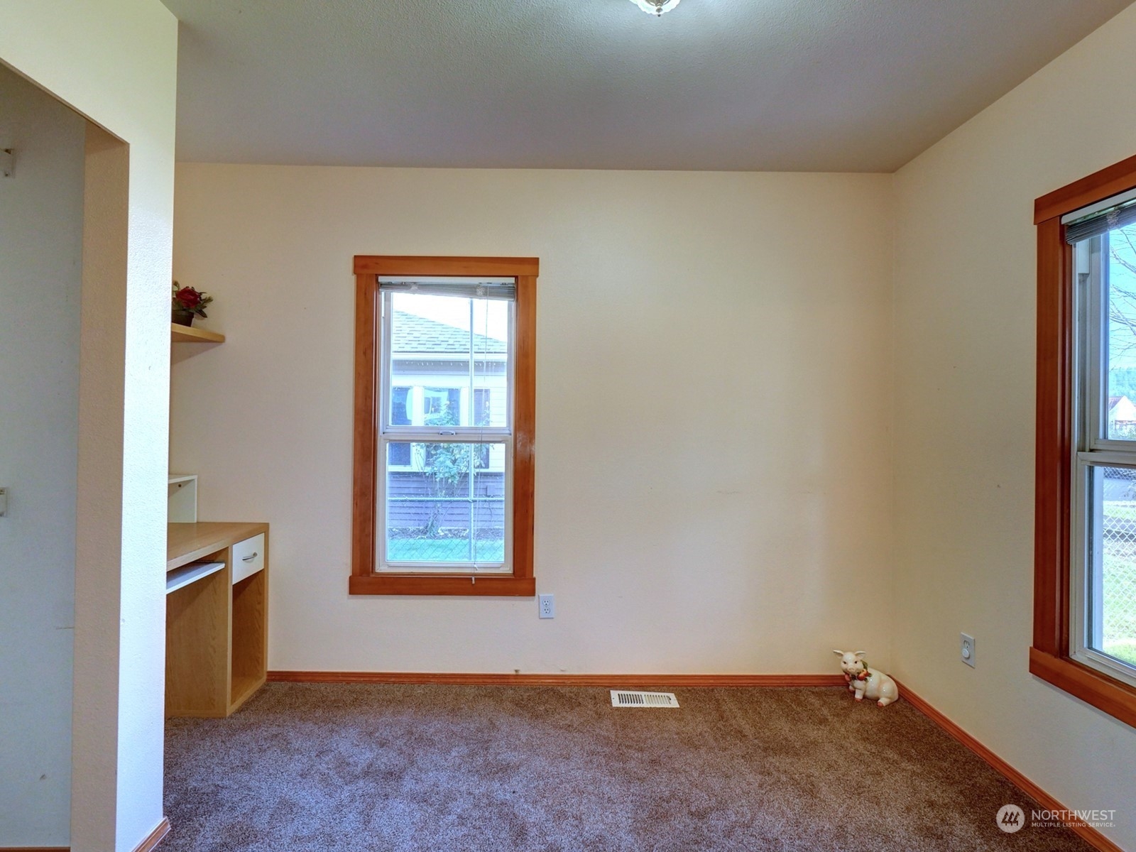 1206 Sumner Avenue Sumner, WA 98390 - Photo 7 of 30 an empty room with windows