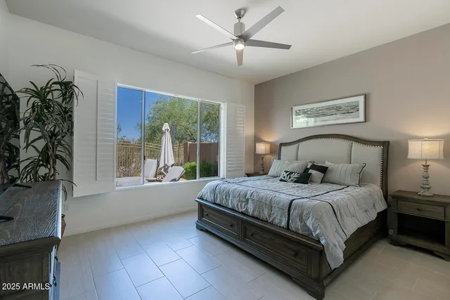 a bedroom with a large bed and a window