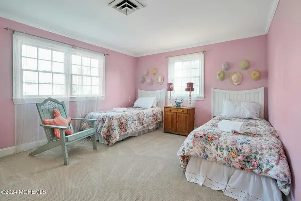 a bed room with a bed and a window