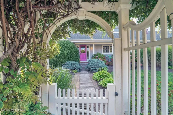 a front view of a house with outdoor seating