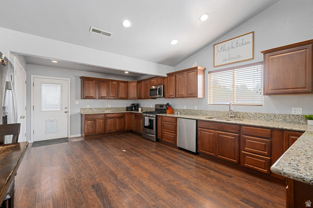348 North Lodge Road Central, UT 84722 - Photo 22 of 25 Kitchen with stainless steel appliances, light stone countertops, dark wood finished floors, wood finish cabinets, and recessed lighting