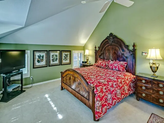 a bedroom with a bed and a chair