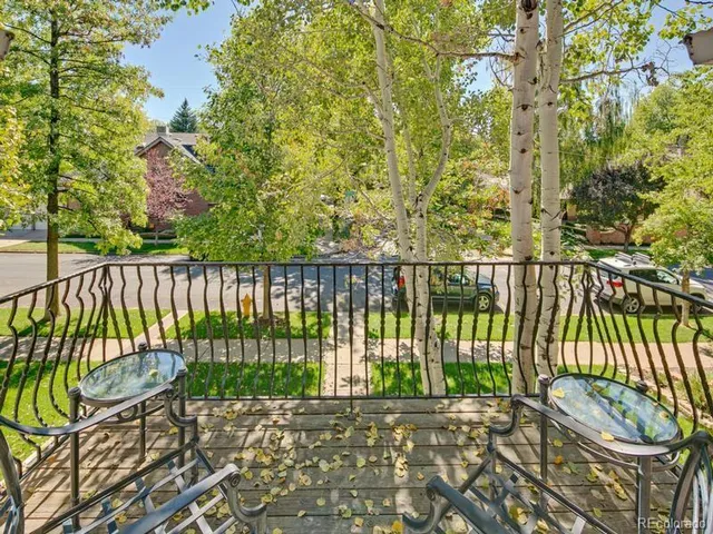 a bedroom with a bed and a night stand