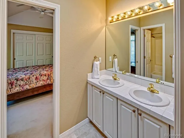 a living room with furniture and stairs