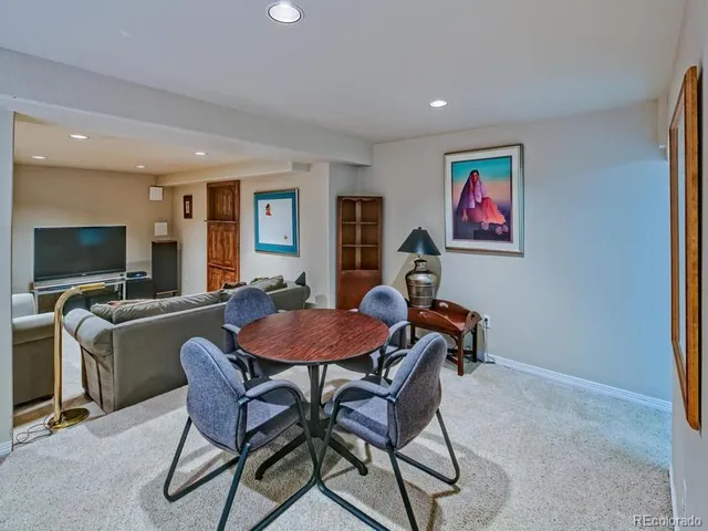 a view of a livingroom with furniture and a flat screen tv