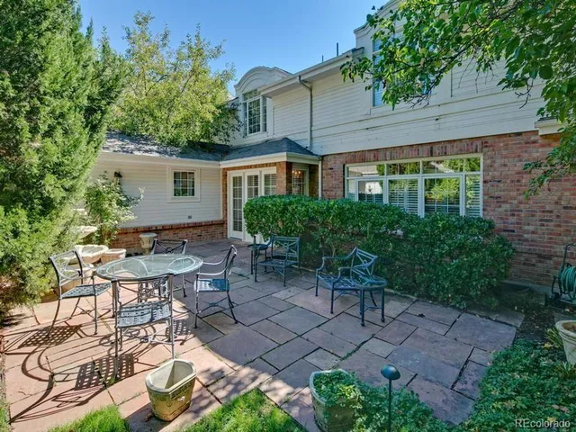 a backyard of a house with plants and trees