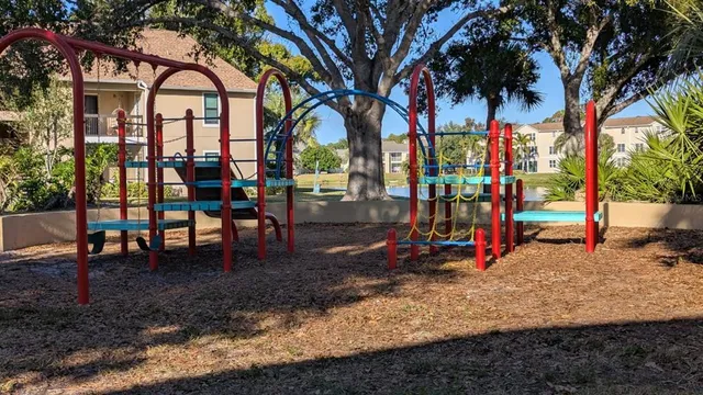 a view of a park with swings and slides