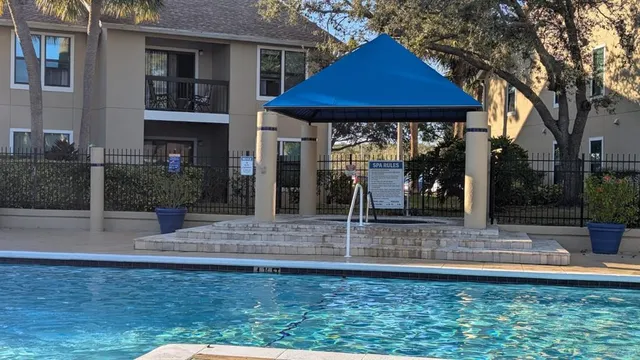 a view of a house with a porch and a potted plant
