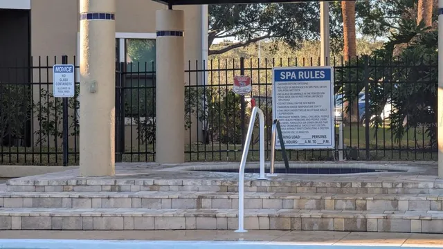 a view of a brick house with large windows