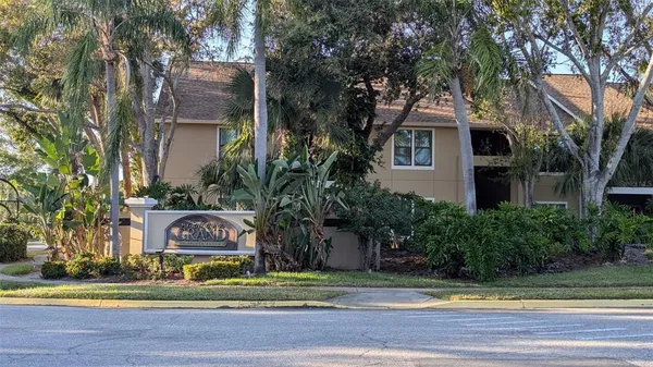 a front view of house with trees