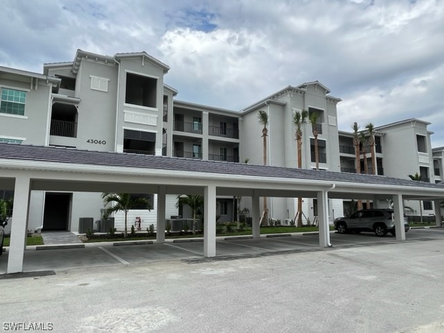 a view of a car park in front of house