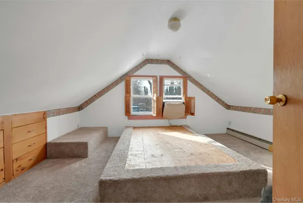 a view of a big room with closet and windows