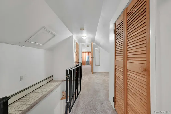 a view of a hallway with a white walls